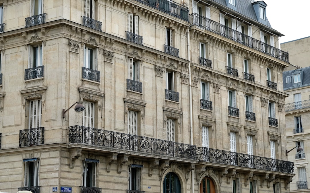 Ornate parisian apartment building with balconies and windows